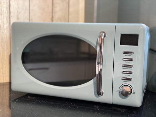 microwave oven on a kitchen side 2023 11 27 05 13 23 utc